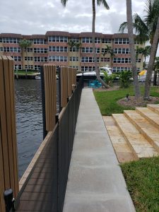 Florida pool fence laws guide showing a compliant mesh barrier and self-closing gate around a backyard pool