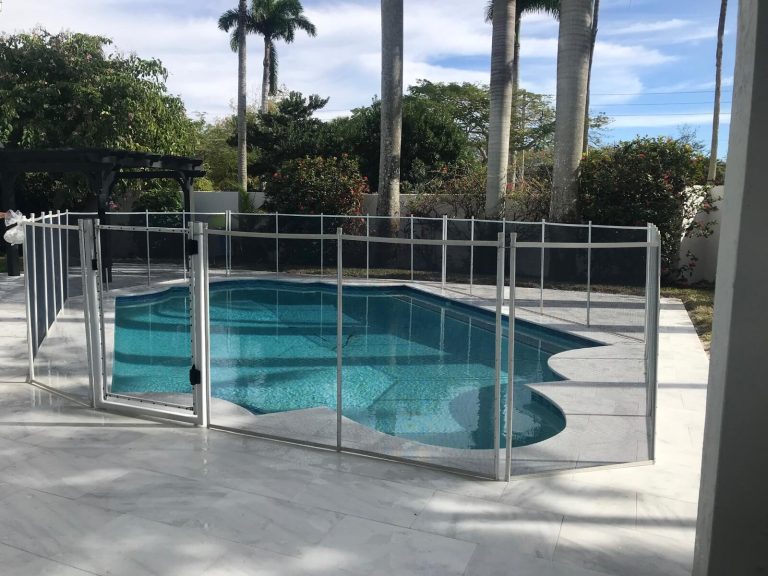 White-framed mesh pool fence and gate at a Pembroke Pines home